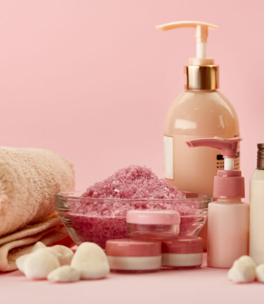 Skin care products on pink background, nobody. Healthcare procedures concept, hygiene cosmetic, healthy lifestyle, spa and bath