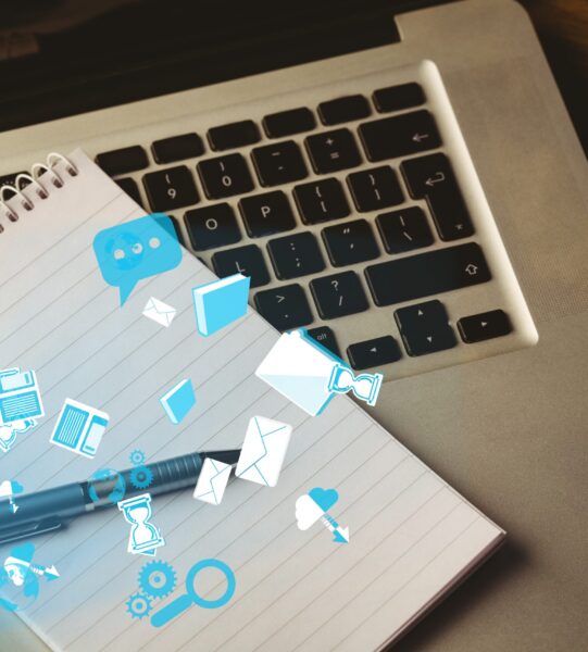 digital composite of note pad on laptop with graphics digital composite of note pad on laptop with graphics